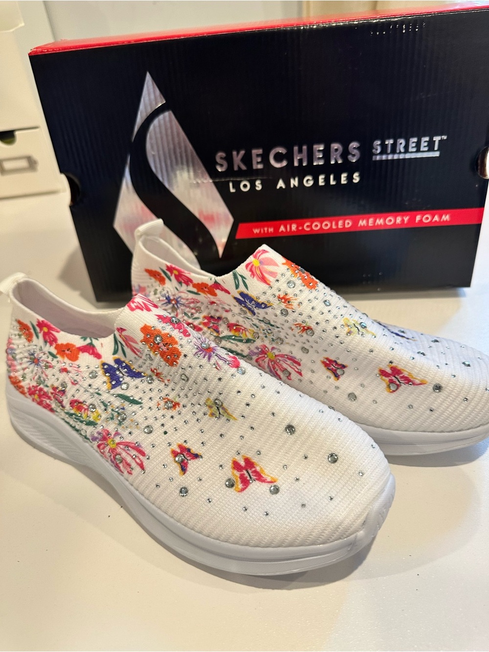 Skechers White Slip-On Knit Sneakers with Multicolor Floral Print & Crystals